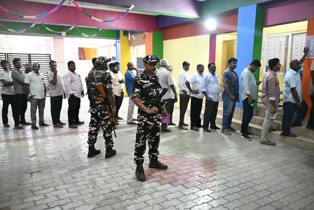 Voters queue to cast their vote outside a polling station during the 2026 Tamil Nadu Legislative Assembly elections in Chennai on April 23, 2026. (Photo by R.Satish BABU / AFP)