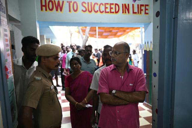 Voters queue to cast their vote outside a polling station during the 2026 Tamil Nadu Legislative Assembly elections in Chennai on April 23, 2026. (Photo by R.Satish BABU / AFP)