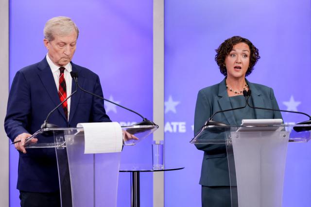 Democratic candidates Tom Steyer and Katie Porter (R) participate in a California gubernatorial debate at the studios of KRON4 in San Francisco, on April 22, 2026. The six leading candidates for California governor are participating in the first major televised debate, ahead of the June 2 primary elections. (Photo by Jason Henry / POOL / AFP)