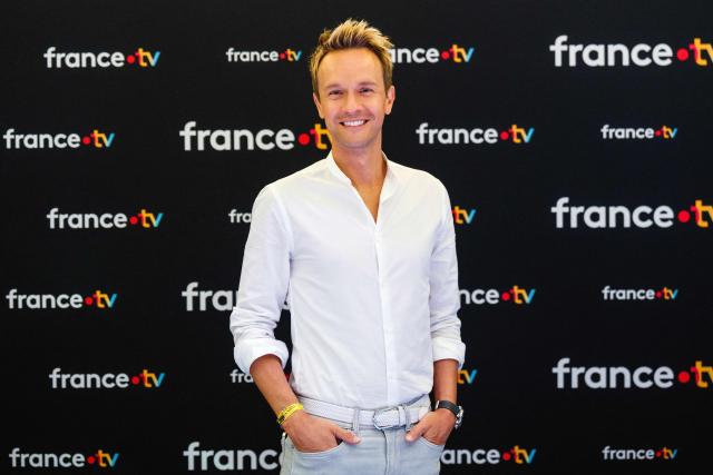 (FILES) French TV host Cyril Feraud poses during a photocall before a press conference to present the new season of France Televisions audiovisual group in Paris on July 8, 2025. Cyril Feraud will become the new host of the France 2 TV channel game show "Fort Boyard" at the summer of 2026. (Photo by DIMITAR DILKOFF / AFP)