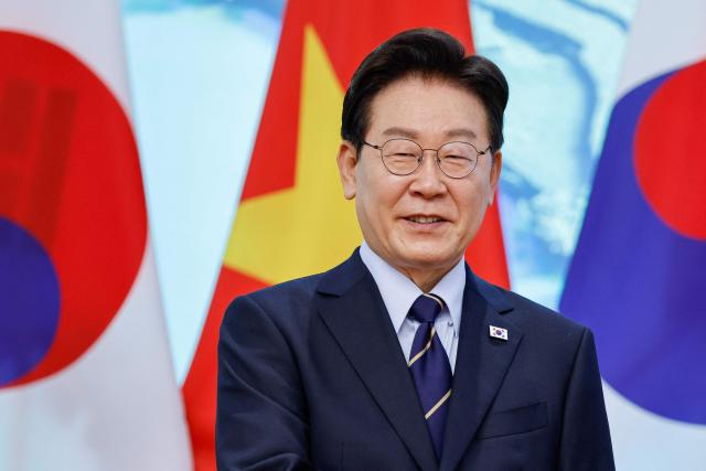 South Korea's President Lee Jae Myung looks on during a meeting with Vietnam's Prime Minister Le Minh Hung at the Government Office in Hanoi on April 23, 2026. (Photo by LUONG THAI LINH / POOL / AFP)