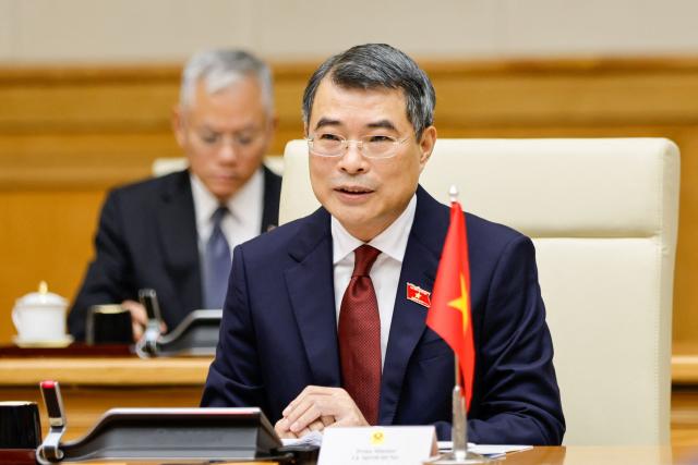 Vietnam's Prime Minister Le Minh Hung speaks during a meeting with South Korea's President Lee Jae Myung at the Government Office in Hanoi on April 23, 2026. (Photo by LUONG THAI LINH / POOL / AFP)