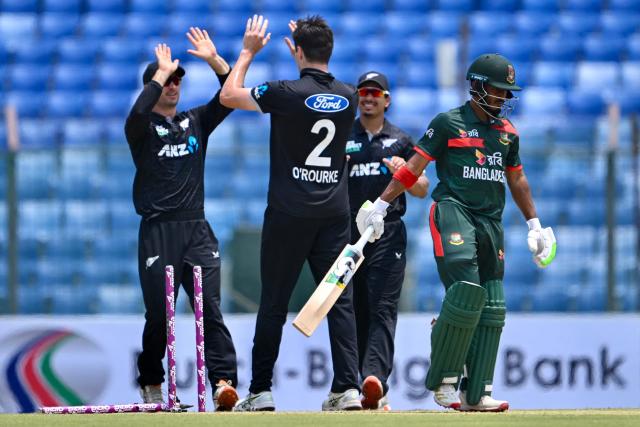 Bangladesh's Tanzid Hasan (R) walks back to the pavilion after his dismissal during the third one-day international (ODI) cricket match between Bangladesh and New Zealand at the Bir Sreshtho Flight Lieutenant Matiur Rahman Stadium in Chittagong on April 23, 2026. (Photo by Munir UZ ZAMAN / AFP)