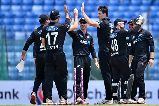 New Zealand's Will O’Rourke (C) celebrates with teammates after taking the wicket of Bangladesh's Tanzid Hasan during the third one-day international (ODI) cricket match between Bangladesh and New Zealand at the Bir Sreshtho Flight Lieutenant Matiur Rahman Stadium in Chittagong on April 23, 2026. (Photo by Munir UZ ZAMAN / AFP)