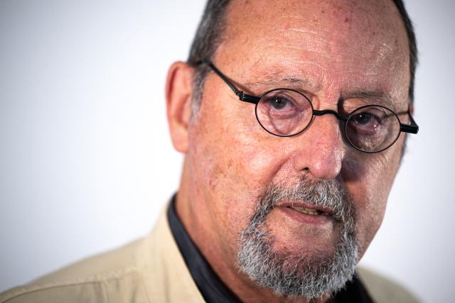 In this picture taken on April 20, 2026, French actor Jean Reno poses during an interview with AFP in Tokyo. Actor Jean Reno takes to the stage in Japan, where he enjoys great renown, to present his autobiographical play "Le Chameau". (Photo by Philip FONG / AFP)