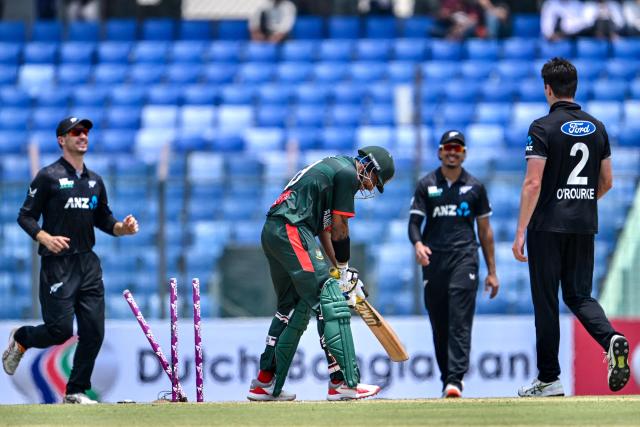 Bangladesh's Soumya Sarkar (2L) reacts after his dismissal by New Zealand's Will O’Rourke (R) during the third one-day international (ODI) cricket match between Bangladesh and New Zealand at the Bir Sreshtho Flight Lieutenant Matiur Rahman Stadium in Chittagong on April 23, 2026. (Photo by MUNIR UZ ZAMAN / AFP)