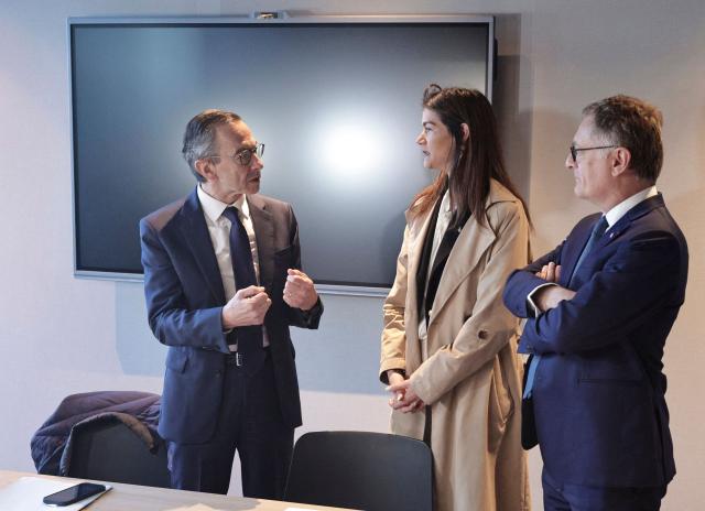 Les Republicains (LR) president and candidate for the 2027 presidential election Bruno Retailleau speaks with the president of 'Nanterre Enseble' and Les Republicains' party member Hélène Matouk (C) and Droite Republicaine's MP Philippe Juvin (R) during a visit at the Pablo-Picasso neighborhood in Nanterre, on the outskirts of Paris, on April 23, 2026. On April 19, 2026, members of French right wing party Les Républicains chose the party leader, Bruno Retailleau, as their candidate for the 2027 presidential election, with 73,8% of the vote in a consultation, thereby ruling out the organization of an internal primary in June, the party announced in a statement. (Photo by STEPHANE DE SAKUTIN / AFP)