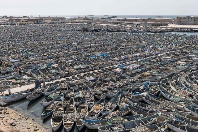 A general view of pirogues docked at the Port Artisanal in Nouadhibou, on April 22, 2026. (Photo by PATRICK MEINHARDT / AFP)