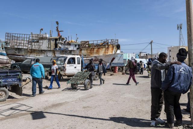 A fisherman pushes a cart at the Port Artisanal in Nouadhibou, on April 22, 2026. (Photo by PATRICK MEINHARDT / AFP)