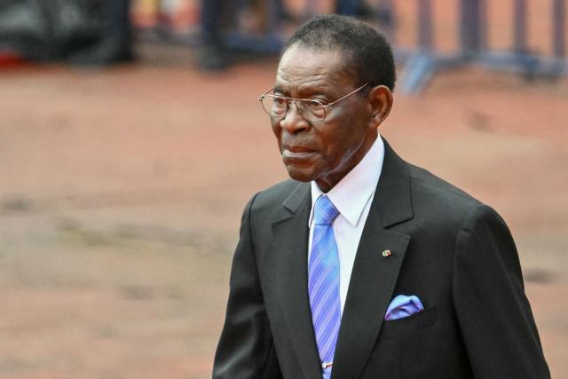 Equatorial Guinea's President Teodoro Obiang Nguema Mbasogo arrives ahead of Pope Leo XIV leading a Holy Mass at the Malabo Stadium in Malabo on the last day of an 11-day apostolic journey to Africa, on April 23, 2026. (Photo by Alberto PIZZOLI / AFP)