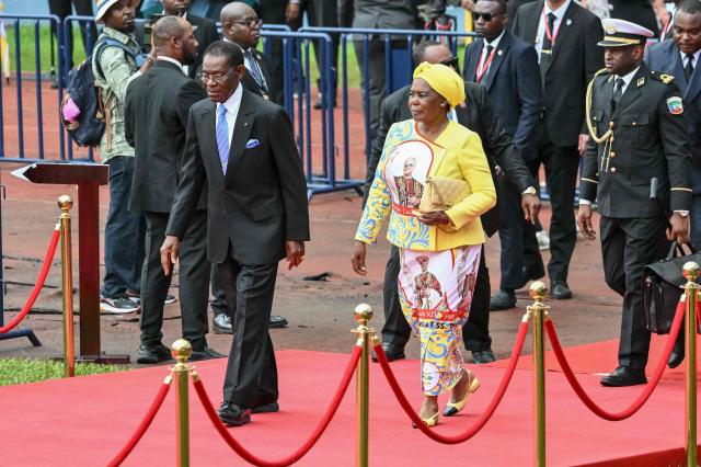 Equatorial Guinea's President Teodoro Obiang Nguema Mbasogo (CL) and Equatorial Guinea's First Lady Constancia Mangue (CR) arrive ahead of Pope Leo XIV leading a Holy Mass at the Malabo Stadium in Malabo on the last day of an 11-day apostolic journey to Africa, on April 23, 2026. (Photo by Alberto PIZZOLI / AFP)