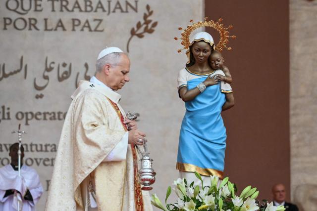 Pope Leo XIV carries the thurible as he leads a Holy Mass at the Malabo Stadium in Malabo on the last day of an 11-day apostolic journey to Africa, on April 23, 2026. (Photo by Alberto PIZZOLI / AFP)