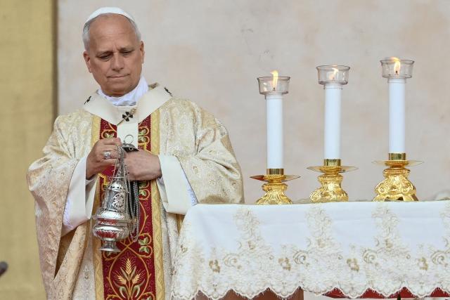 Pope Leo XIV carries the thurible as he leads a Holy Mass at the Malabo Stadium in Malabo on the last day of an 11-day apostolic journey to Africa, on April 23, 2026. (Photo by Alberto PIZZOLI / AFP)