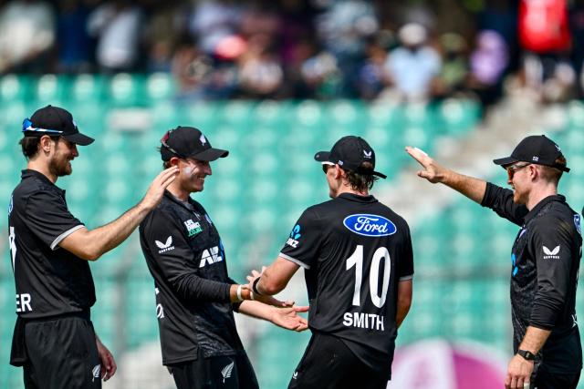 New Zealand's players celebrate after the dismissal of Bangladesh's Najmul Hossain Shanto during the third one-day international (ODI) cricket match between Bangladesh and New Zealand at the Bir Sreshtho Flight Lieutenant Matiur Rahman Stadium in Chittagong on April 23, 2026. (Photo by Munir UZ ZAMAN / AFP)