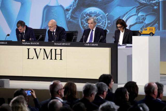 (From L) LVMH executive vice president general for administration and legal affairs Jerome Sibille, managing director Stephane Bianchi, chairman and CEO Bernard Arnault, and CFO Cecile Cabanis attend the annual general meeting of the world's leading luxury group LVMH at the Carrousel du Louvre in Paris on April 23, 2026. (Photo by Ludovic MARIN / AFP)