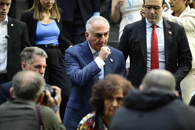 The son of Iran's last shah, exiled Crown Prince Reza Pahlavi leaves after a press conference at the BPK (Bundespressekonferenz) building in Berlin, on April 23, 2026. (Photo by John MACDOUGALL / AFP)