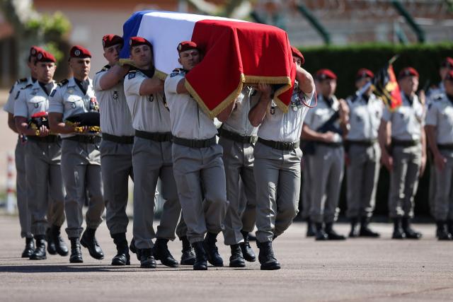 Members of 17th Parachute Engineer Regiment carry the coffin of late French UNIFIL peacekeeper Sergeant-Major Florian Montorio, killed during an attack against UNIFIL (United Nations Interim Force in Lebanon) in southern Lebanon last weekend, during a tribute ceremony at the military barracks in Montauban, southwestern France, on April 23, 2026. Florian Montorio attached to the 17th Parachute Engineer Regiment in Montauban, in south-western France, was killed during an ambush on UNIFIL peacekeepers on April 18. A second soldier, French Army Staff Sergeant Anicet Girardin, died on April 22 "of the consequences of his wounds" suffered following the weekend ambush. (Photo by Valentine CHAPUIS / AFP)
