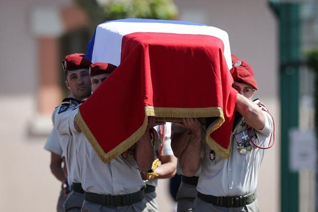 Members of 17th Parachute Engineer Regiment carry the coffin of late French UNIFIL peacekeeper Sergeant-Major Florian Montorio, killed during an attack against UNIFIL (United Nations Interim Force in Lebanon) in southern Lebanon last weekend, during a tribute ceremony at the military barracks in Montauban, southwestern France, on April 23, 2026. Florian Montorio attached to the 17th Parachute Engineer Regiment in Montauban, in south-western France, was killed during an ambush on UNIFIL peacekeepers on April 18. A second soldier, French Army Staff Sergeant Anicet Girardin, died on April 22 "of the consequences of his wounds" suffered following the weekend ambush. (Photo by Valentine CHAPUIS / AFP)