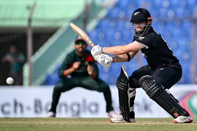 New Zealand's Henry Nicholls plays a shot during the third one-day international (ODI) cricket match between Bangladesh and New Zealand at the Bir Sreshtho Flight Lieutenant Matiur Rahman Stadium in Chittagong on April 23, 2026. (Photo by Munir UZ ZAMAN / AFP)