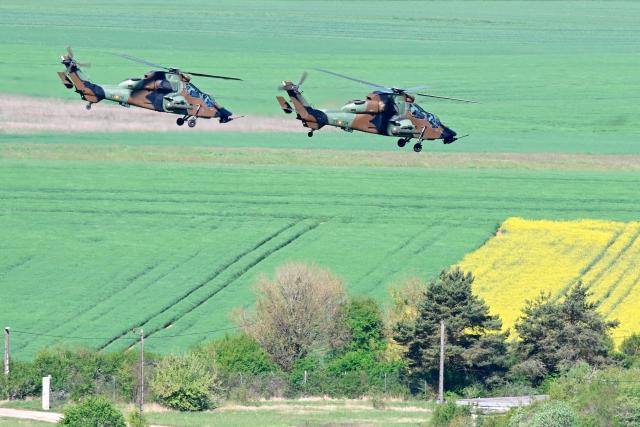 Spanish Army Tigre attack helicopters fly after taking off from Chaumont-Semoutiers airbase during the ORION 26 military drill in Semoutiers-Montsaon, northeastern France, on April 23, 2026. (Photo by Jean-Christophe VERHAEGEN / AFP)