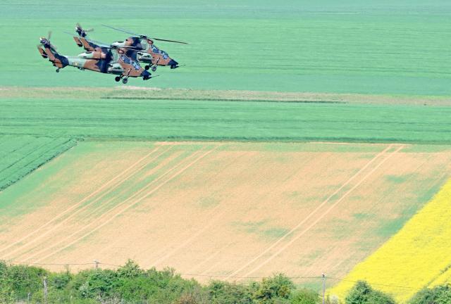 Spanish Army Tigre attack helicopters fly after taking off from Chaumont-Semoutiers airbase during the ORION 26 military drill in Semoutiers-Montsaon, northeastern France, on April 23, 2026. (Photo by Jean-Christophe VERHAEGEN / AFP)