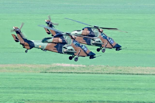 Spanish Army Tigre attack helicopters fly after taking off from Chaumont-Semoutiers airbase during the ORION 26 military drill in Semoutiers-Montsaon, northeastern France, on April 23, 2026. (Photo by Jean-Christophe VERHAEGEN / AFP)