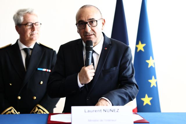 France's Interior Minister Laurent Nunez delivers a speech prior to renew the Sandhurst treaty at the Border Police office of Loon-Plage, near Dunkirk, on April 23, 2026. Britain and France have agreed a new three-year deal to stop undocumented migrants making the risky journey across the Channel in small boats, the two sides announced. Under the deal, France pledged to increase law enforcement on the coast by more than half to fight irregular migration to Britain -- reaching 1,400 officers by 2029. The Sandhurst treaty sets out the UK's financial contribution to French efforts to stop migrants attempting the perilous sea crossing to Britain. (Photo by Sameer AL-DOUMY / AFP)