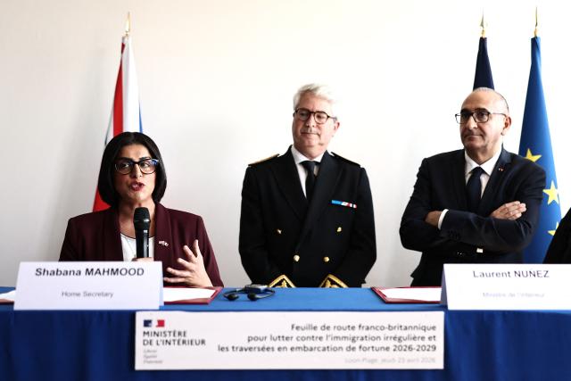 British Home Secretary Shabana Mahmood delivers a speech, next to France's Interior Minister Laurent Nunez (R), prior to renew the Sandhurst treaty at the Border Police office of Loon-Plage, near Dunkirk, on April 23, 2026. Britain and France have agreed a new three-year deal to stop undocumented migrants making the risky journey across the Channel in small boats, the two sides announced. Under the deal, France pledged to increase law enforcement on the coast by more than half to fight irregular migration to Britain -- reaching 1,400 officers by 2029. The Sandhurst treaty sets out the UK's financial contribution to French efforts to stop migrants attempting the perilous sea crossing to Britain. (Photo by Sameer AL-DOUMY / AFP)