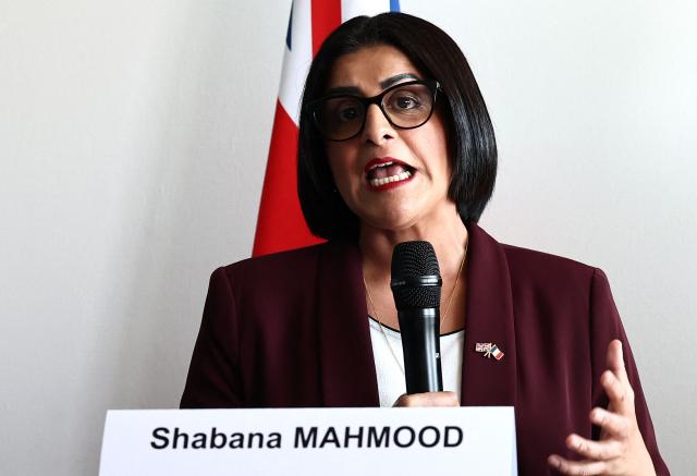 British Home Secretary Shabana Mahmood delivers a speech prior to renew the Sandhurst treaty at the Border Police office of Loon-Plage, near Dunkirk, on April 23, 2026. Britain and France have agreed a new three-year deal to stop undocumented migrants making the risky journey across the Channel in small boats, the two sides announced. Under the deal, France pledged to increase law enforcement on the coast by more than half to fight irregular migration to Britain -- reaching 1,400 officers by 2029. The Sandhurst treaty sets out the UK's financial contribution to French efforts to stop migrants attempting the perilous sea crossing to Britain. (Photo by Sameer AL-DOUMY / AFP)