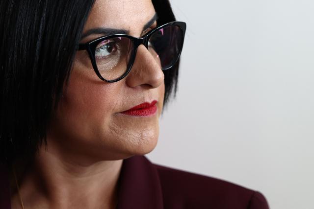 British Home Secretary Shabana Mahmood listens to France's Interior Minister's speech prior to renew the Sandhurst treaty at the Border Police office of Loon-Plage, near Dunkirk, on April 23, 2026. Britain and France have agreed a new three-year deal to stop undocumented migrants making the risky journey across the Channel in small boats, the two sides announced. Under the deal, France pledged to increase law enforcement on the coast by more than half to fight irregular migration to Britain -- reaching 1,400 officers by 2029. The Sandhurst treaty sets out the UK's financial contribution to French efforts to stop migrants attempting the perilous sea crossing to Britain. (Photo by Sameer AL-DOUMY / AFP)