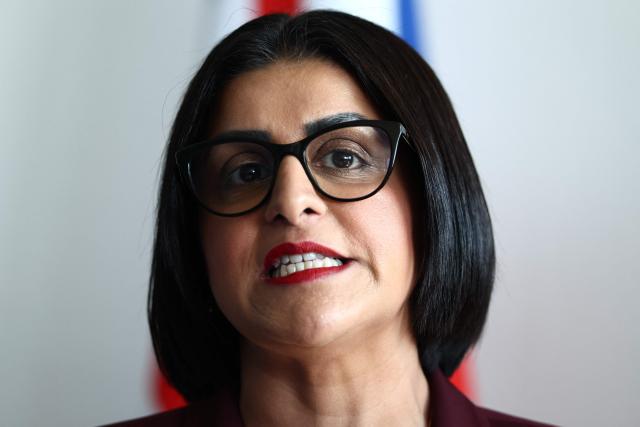 British Home Secretary Shabana Mahmood delivers a speech prior to renew the Sandhurst treaty at the Border Police office of Loon-Plage, near Dunkirk, on April 23, 2026. Britain and France have agreed a new three-year deal to stop undocumented migrants making the risky journey across the Channel in small boats, the two sides announced. Under the deal, France pledged to increase law enforcement on the coast by more than half to fight irregular migration to Britain -- reaching 1,400 officers by 2029. The Sandhurst treaty sets out the UK's financial contribution to French efforts to stop migrants attempting the perilous sea crossing to Britain. (Photo by Sameer AL-DOUMY / AFP)