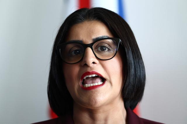 British Home Secretary Shabana Mahmood delivers a speech prior to renew the Sandhurst treaty at the Border Police office of Loon-Plage, near Dunkirk, on April 23, 2026. Britain and France have agreed a new three-year deal to stop undocumented migrants making the risky journey across the Channel in small boats, the two sides announced. Under the deal, France pledged to increase law enforcement on the coast by more than half to fight irregular migration to Britain -- reaching 1,400 officers by 2029. The Sandhurst treaty sets out the UK's financial contribution to French efforts to stop migrants attempting the perilous sea crossing to Britain. (Photo by Sameer AL-DOUMY / AFP)