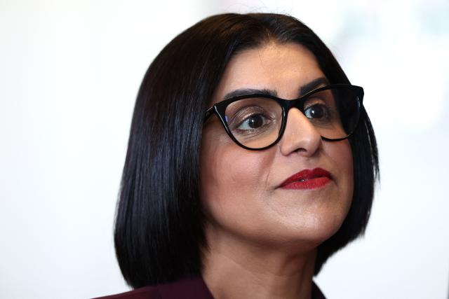 British Home Secretary Shabana Mahmood listens to France's Interior Minister's speech prior to renew the Sandhurst treaty at the Border Police office of Loon-Plage, near Dunkirk, on April 23, 2026. Britain and France have agreed a new three-year deal to stop undocumented migrants making the risky journey across the Channel in small boats, the two sides announced. Under the deal, France pledged to increase law enforcement on the coast by more than half to fight irregular migration to Britain -- reaching 1,400 officers by 2029. The Sandhurst treaty sets out the UK's financial contribution to French efforts to stop migrants attempting the perilous sea crossing to Britain. (Photo by Sameer AL-DOUMY / AFP)