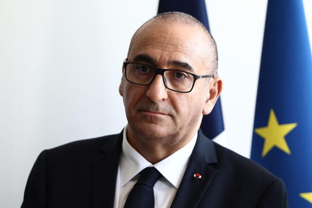 France's Interior Minister Laurent Nunez looks on prior to renew the Sandhurst treaty with British Home Secretary at the Border Police office of Loon-Plage, near Dunkirk, on April 23, 2026. Britain and France have agreed a new three-year deal to stop undocumented migrants making the risky journey across the Channel in small boats, the two sides announced. Under the deal, France pledged to increase law enforcement on the coast by more than half to fight irregular migration to Britain -- reaching 1,400 officers by 2029. The Sandhurst treaty sets out the UK's financial contribution to French efforts to stop migrants attempting the perilous sea crossing to Britain. (Photo by Sameer AL-DOUMY / AFP)