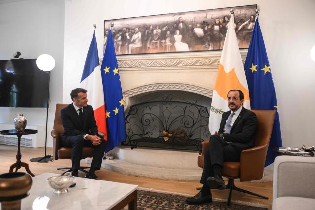 Cyprus’ President Nikos Christodoulides (R) meets with his French counterpart Emmanuel Macron at the Presidential Palace in Nicosia on April 23, 2026, on the sidelines of a European summit. (Photo by Jewel SAMAD / POOL / AFP)