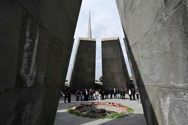 People visit the Tsitsernakaberd Armenian Genocide Memorial in Yerevan on April 23, 2026, on the eve of the Genocide Remembrance Day - which will mark the 111th anniversary of the World War I-era mass killings of Armenians under the Ottoman Empire in 1915. (Photo by KAREN MINASYAN / AFP)