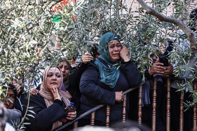 Relatives mourn the death of Awda Atef Awawdeh during his funeral in Deir Dibwan in the Israeli-occupied West Bank, on April 23, 2026. The Palestinian health ministry said Israeli settlers shot dead a Palestinian man in the occupied West Bank on April 22, the third victim of deadly gunfire in two days. The ministry said 25-year-old Awawdeh was killed by settler gunfire in the central West Bank town of Deir Dibwan, just east of Ramallah. (Photo by Zain JAAFAR / AFP)