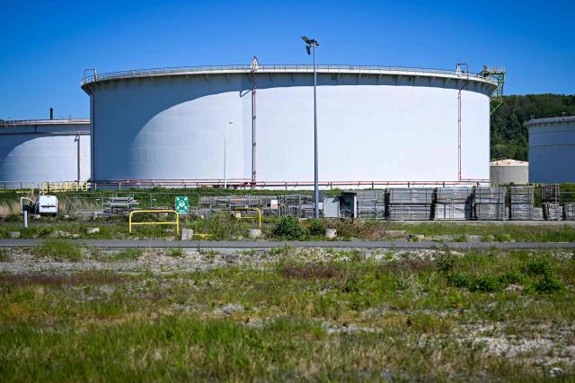 This photograph shows tanks of the TotalEnergies refinery platform in Gronfreville-L’Orcher, near Le Havre, northwestern France, on April 23, 2026. (Photo by Lou BENOIST / AFP)