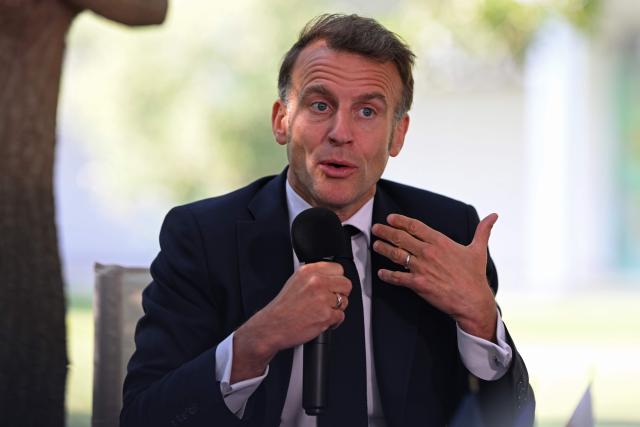France's President Emmanuel Macron addresses the students of the French School in Nicosia on April 23, 2026, ahead of a meeting on the sidelines of a European summit. (Photo by Jewel SAMAD / AFP)