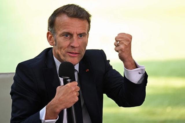 France's President Emmanuel Macron addresses the students of the French School in Nicosia on April 23, 2026, ahead of a meeting on the sidelines of a European summit. (Photo by Jewel SAMAD / AFP)