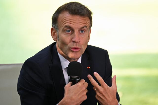 France's President Emmanuel Macron addresses the students of the French School in Nicosia on April 23, 2026, ahead of a meeting on the sidelines of a European summit. (Photo by Jewel SAMAD / AFP)