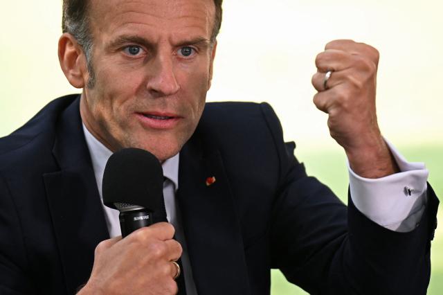 France's President Emmanuel Macron addresses the students of the French School in Nicosia on April 23, 2026, ahead of a meeting on the sidelines of a European summit. (Photo by Jewel SAMAD / AFP)