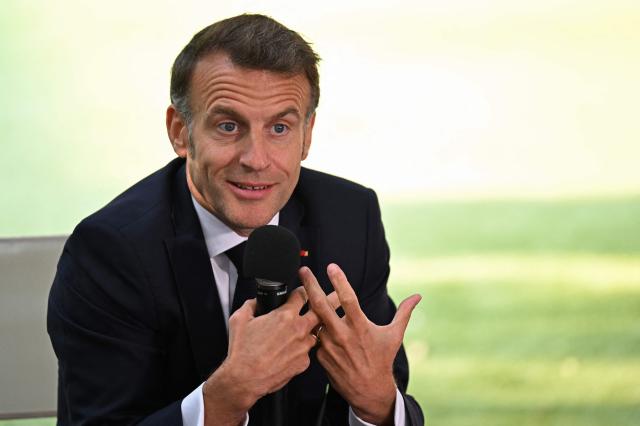France's President Emmanuel Macron addresses the students of the French School in Nicosia on April 23, 2026, ahead of a meeting on the sidelines of a European summit. (Photo by Jewel SAMAD / AFP)