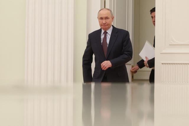 Russian President Vladimir Putin arrives to meet with Kyrgyzstan's President at the Kremlin in Moscow on April 23, 2026. (Photo by MAXIM SHIPENKOV / POOL / AFP)