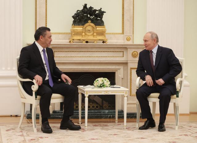 Russian President Vladimir Putin and Kyrgyzstan's President Sadyr Japarov hold a meeting at the Kremlin in Moscow on April 23, 2026. (Photo by MAXIM SHIPENKOV / POOL / AFP)