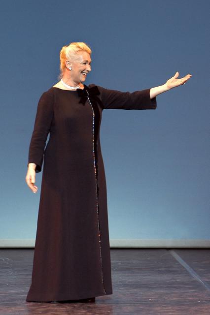 (FILES) Former prima ballerina Claude Bessy (C), who is set to step down as director of her dance school at the end of the season, waves to the audience on March 30, 2004 on the stage of the Palais Garnier in Paris, during an evening of tributes and testimonials to the significance of her work over the past thirty years. Former prima ballerina Claude Bessy, who headed the Paris Opera Ballet School for 30 years and revolutionised its teaching methods, died on April 23, 2026 at the age of 93, the institution announced. (Photo by STEPHANE DE SAKUTIN / AFP)