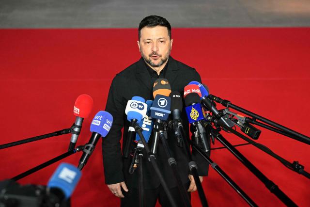 Ukraine's President Volodymyr Zelensky speaks to media upon his arrival ahead of an informal meeting of the European Council, in Ayia Napa on April 23, 2026. (Photo by NICOLAS TUCAT / AFP)