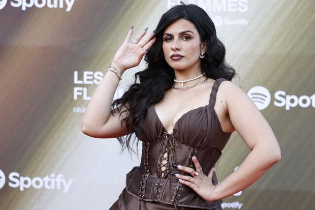 French rapper Eve la Marka poses for a photocall upon arrival for the fourth edition of "Les Flammes" music award ceremony at the Seine Musicale, in Boulogne-Billancourt, in the western outskirts of Paris on April 23, 2026. (Photo by SIMON WOHLFAHRT / AFP)