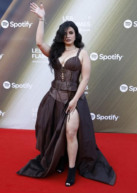 French rapper Eve la Marka poses for a photocall upon arrival for the fourth edition of "Les Flammes" music award ceremony at the Seine Musicale, in Boulogne-Billancourt, in the western outskirts of Paris on April 23, 2026. (Photo by SIMON WOHLFAHRT / AFP)