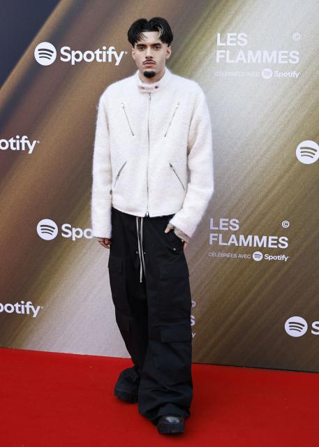 French rapper and artist RnBoi poses for a photocall upon arrival for the fourth edition of "Les Flammes" music award ceremony at the Seine Musicale, in Boulogne-Billancourt, in the western outskirts of Paris on April 23, 2026. (Photo by SIMON WOHLFAHRT / AFP)